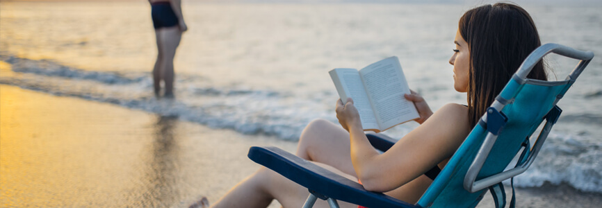 Outer Banks literature woman reading on the beach